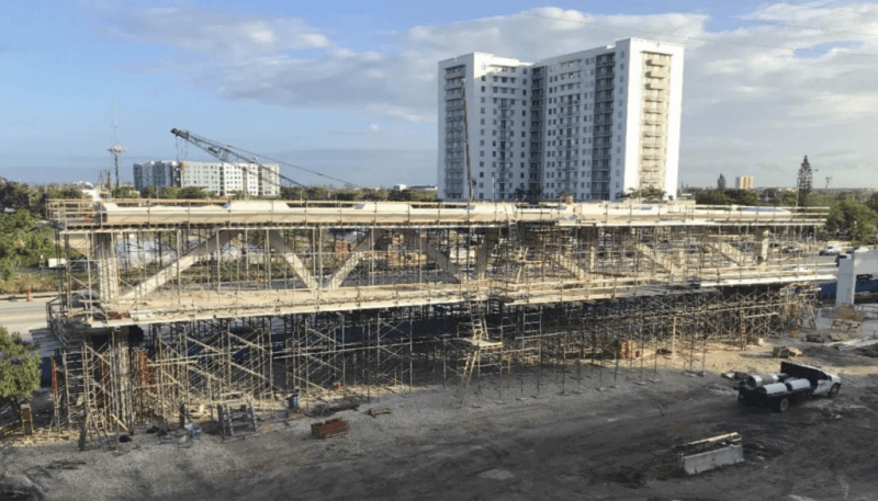 Image showing the main truss span of the FIU bridge and its formwork on the side of the roadway near the construction site