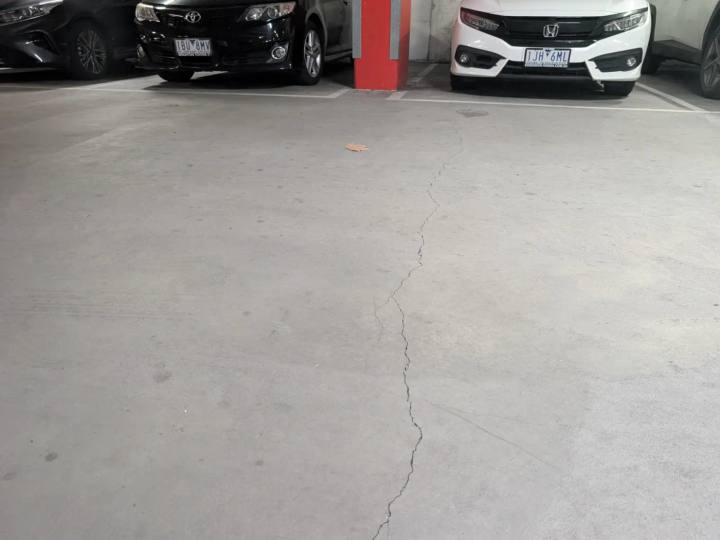 Long crack running through a concrete basement car park slab