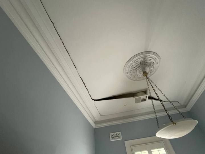 Cracking along a ceiling and cornice line in a period room