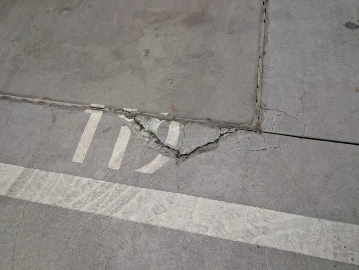 Cracking and spalling along a joint in a concrete slab