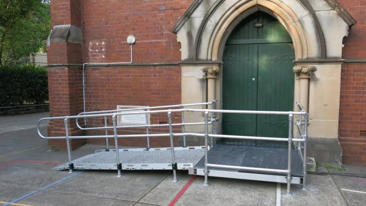Compliant access ramp installed at the entry of a heritage church